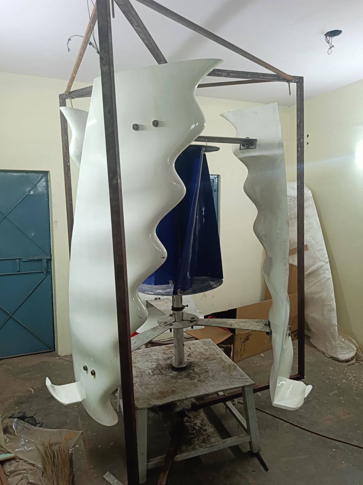 The fully assembled full-size GIVARA ONE machine standing in its steel test frame at the Noida workshop.